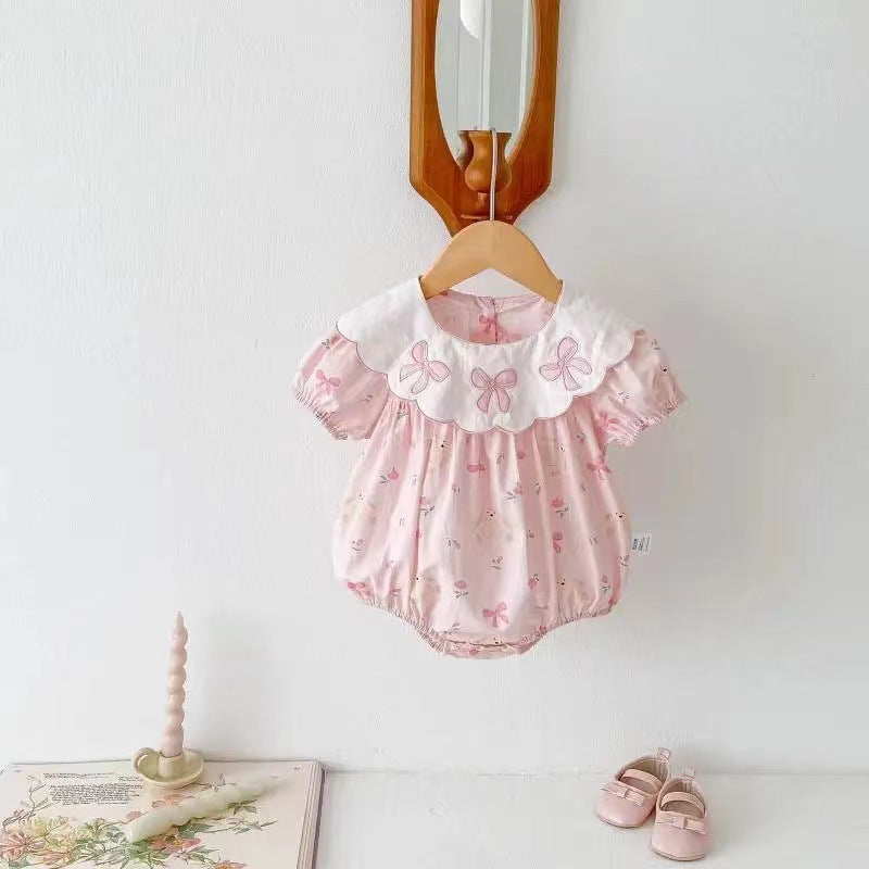 Tutina rosa con colletto bianco ricamato e stampa orsacchiotti