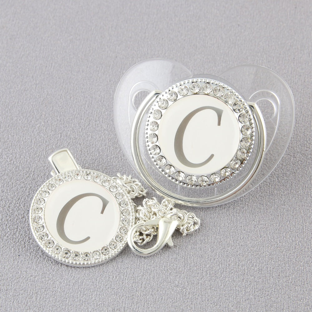 Set Ciuccio Trasparente e argento Luxury con Clip – Personalizzato con Iniziale 6-12 mesi