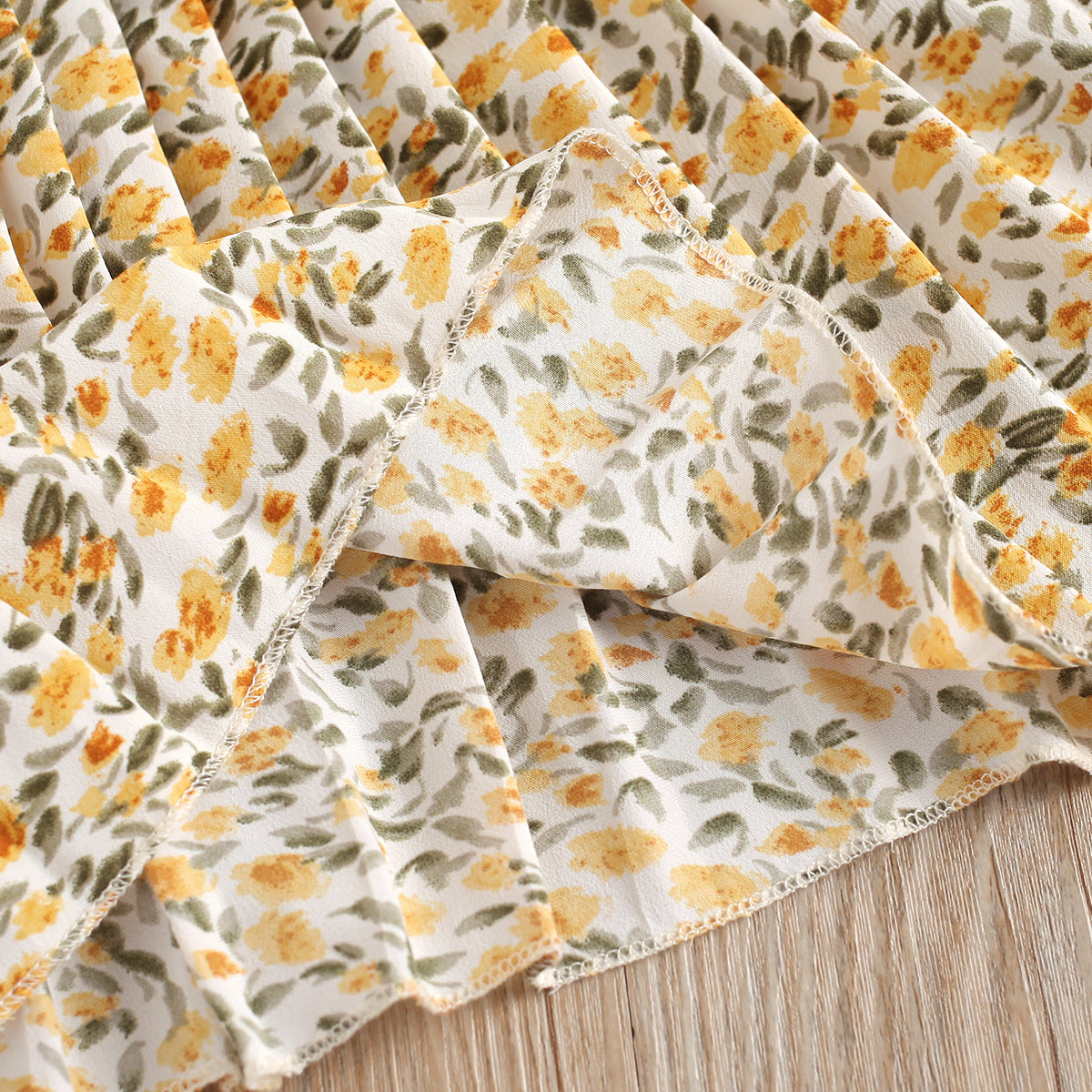 Completo estivo bambina – Top arancione e gonna floreale con cintura