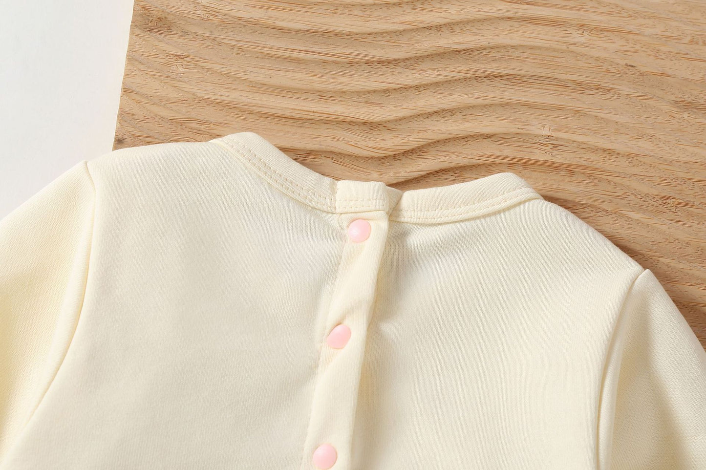 Pagliaccetto bimba con fiocco rosa e cappellino