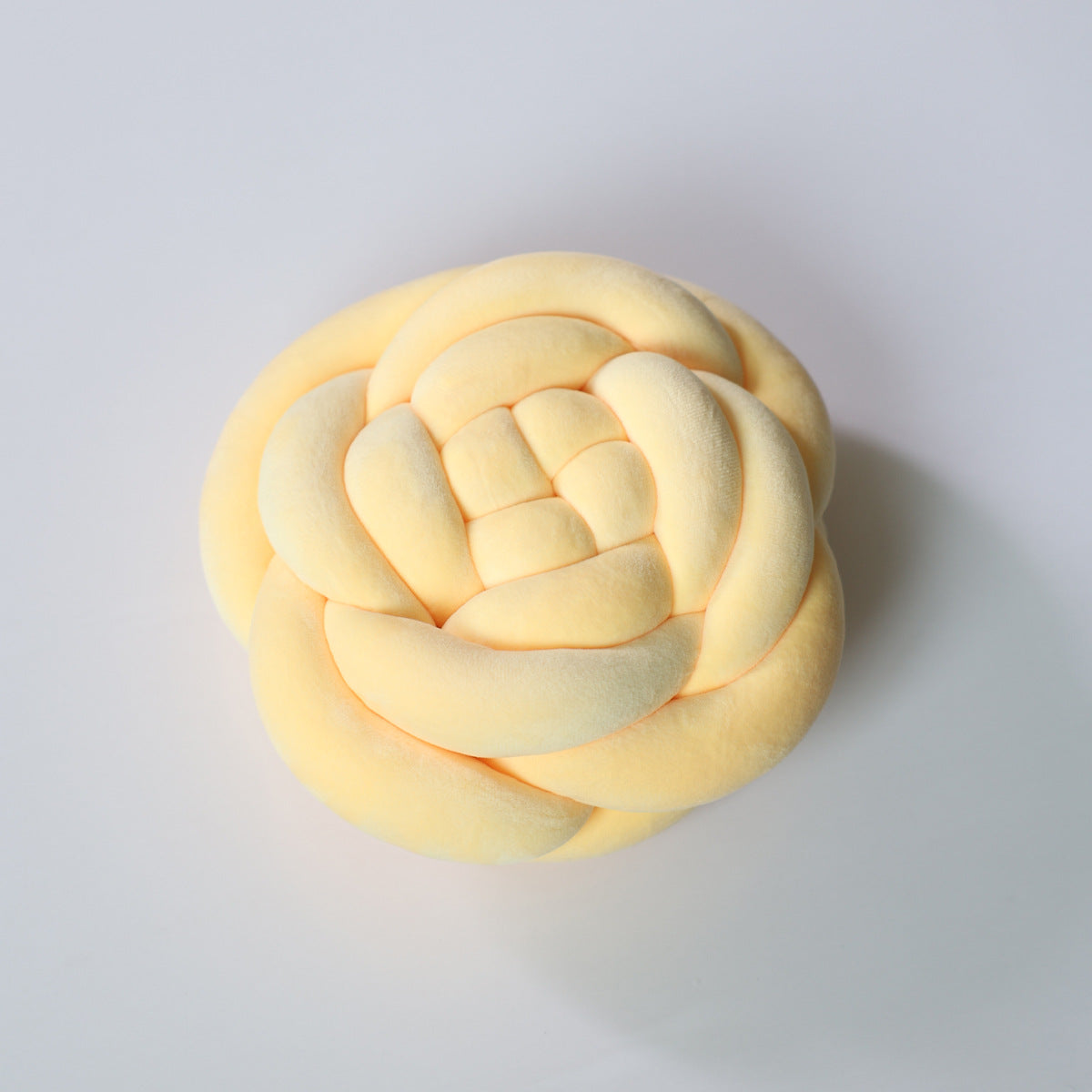 Cuscino Rosa intrecciato – Decorativo e Morbido