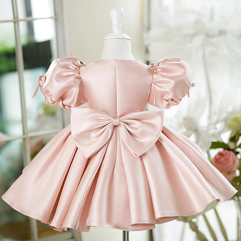 Abito da cerimonia bambina in raso rosa cipria con maniche a palloncino