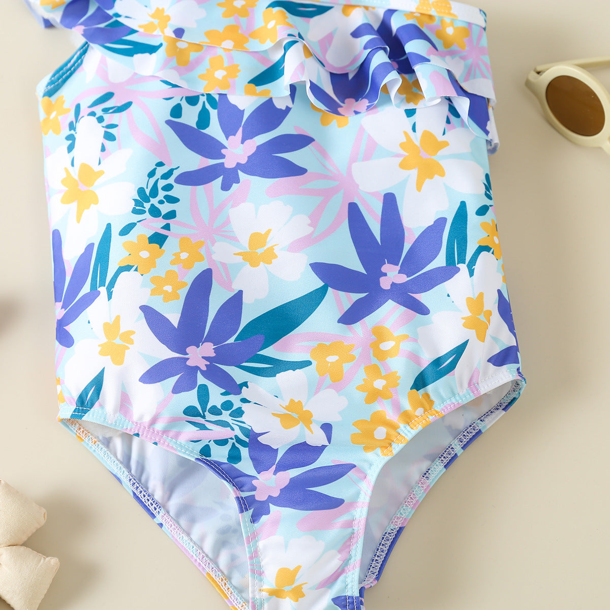 Costume intero bambina a fiori monospalla con volant