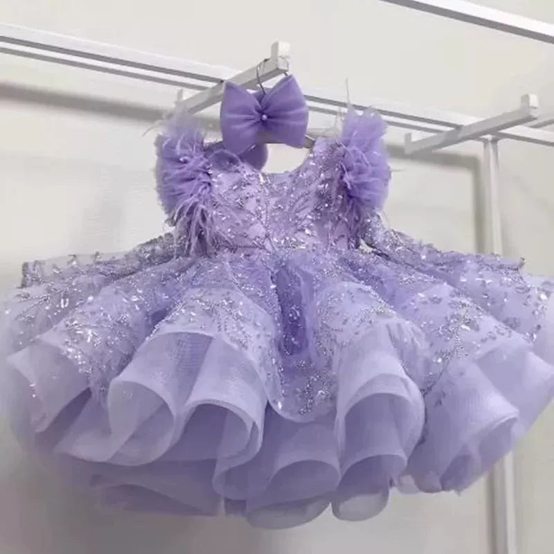 Vestito elegante bambina con piume e ricami glitter – Rosa o Lilla