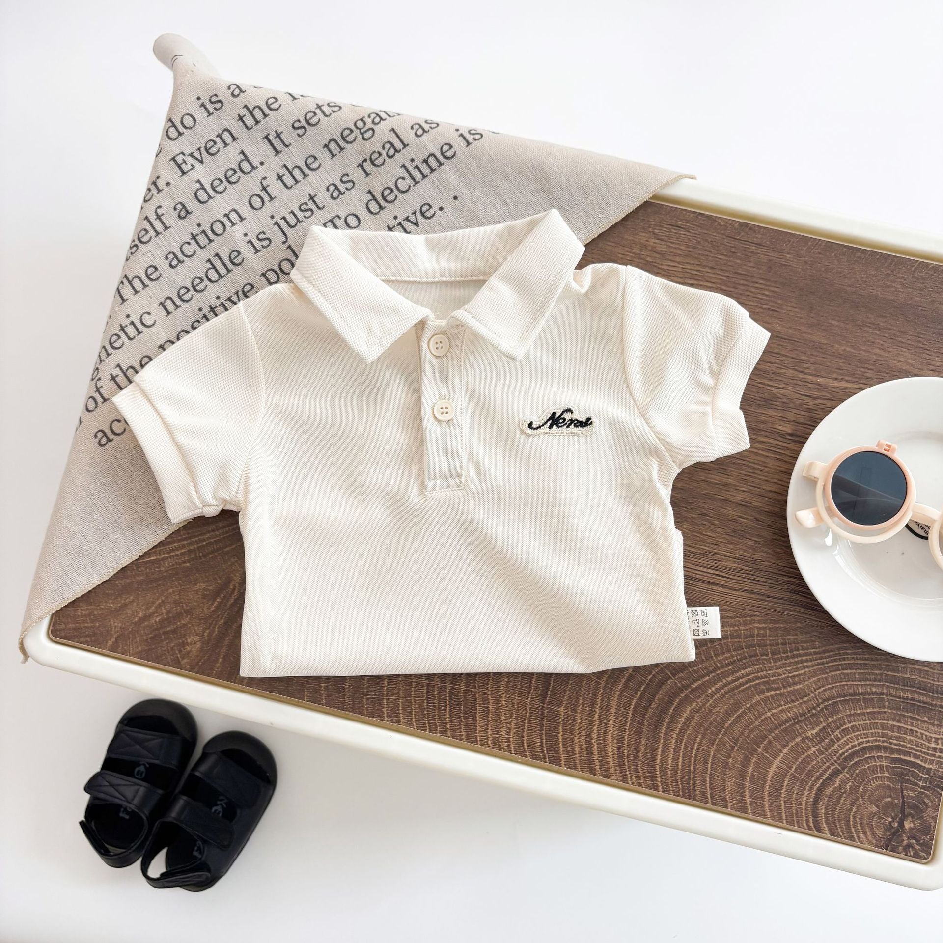 Body polo estivo unisex color panna con bottoncini