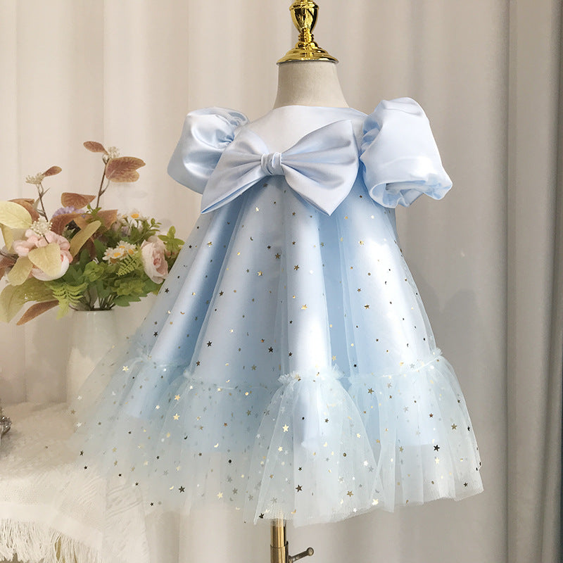 Abito Celeste Bimba con Tulle Stellato e Fiocco Elegante