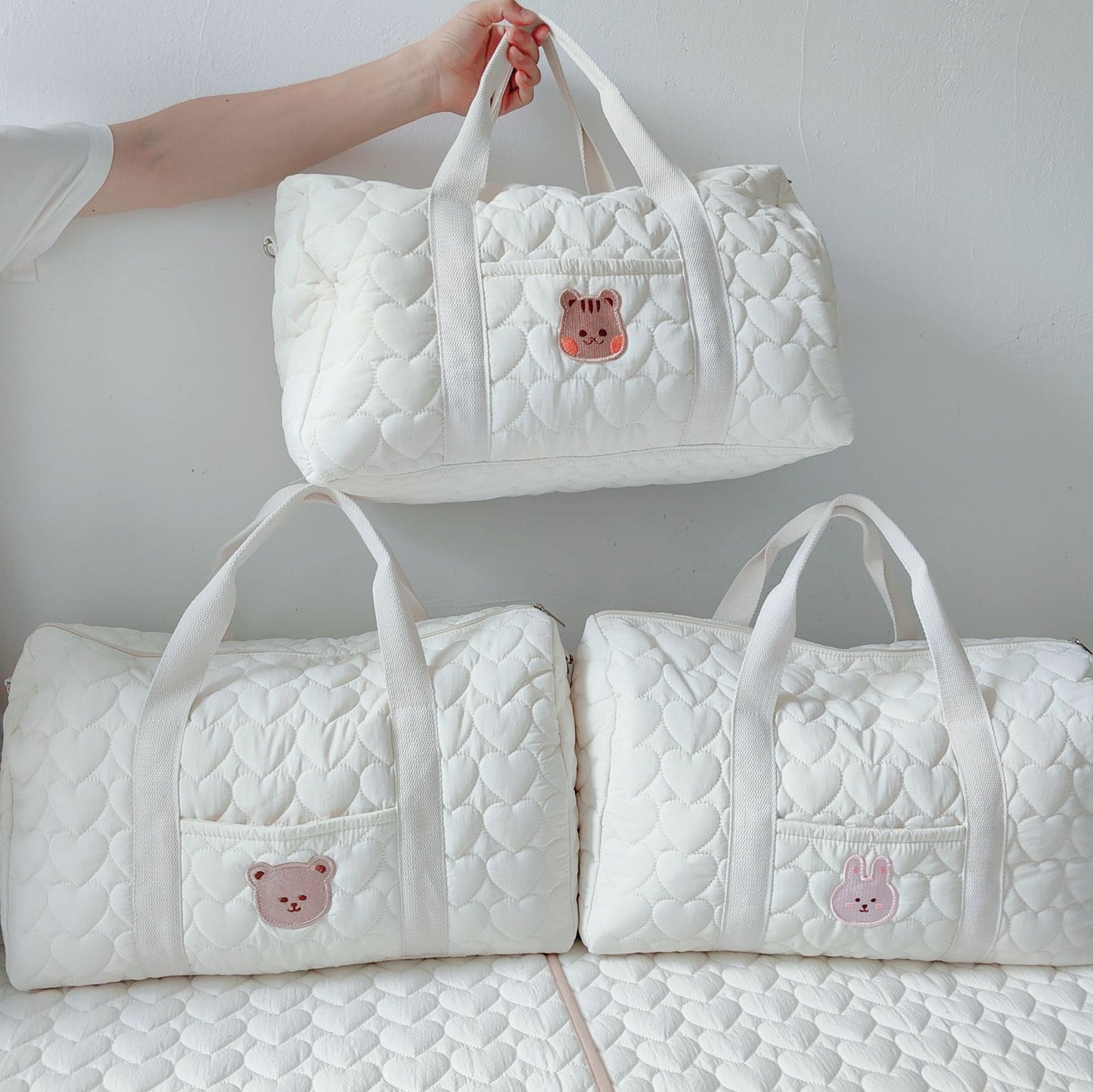 Borsone trapuntata bianca con patch animaletti