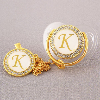 Set Ciuccio Trasparente e oro  Luxury con Clip – Personalizzato con Iniziale 6-12 mesi
