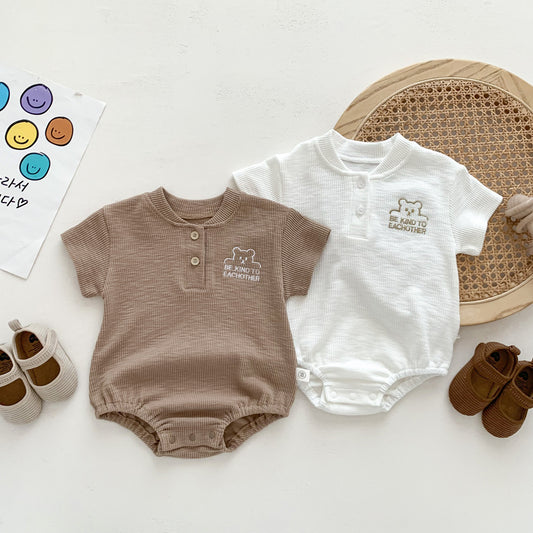 Body estivo unisex in cotone waffle con scritta “Be Kind To Each Other”