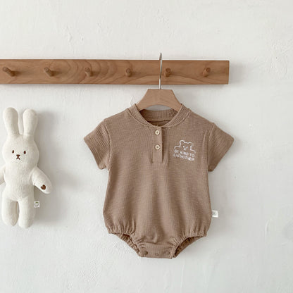 Body estivo unisex in cotone waffle con scritta “Be Kind To Each Other”