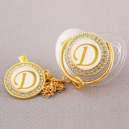 Set Ciuccio Trasparente e oro  Luxury con Clip – Personalizzato con Iniziale 6-12 mesi