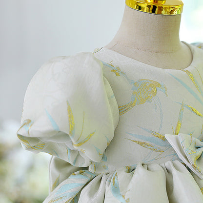 Abito cerimonia bambina elegante con maniche a sbuffo e fiocco