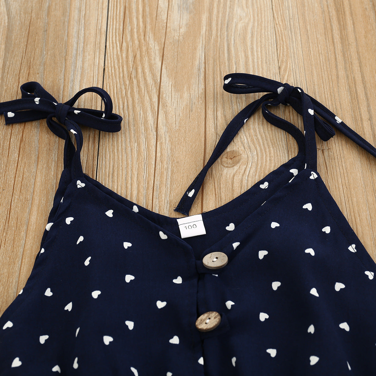 Tuta estiva bambina con cuoricini – Blu navy con fiocco e bottoni