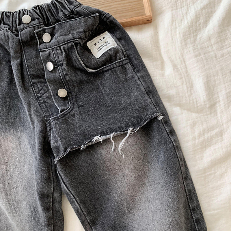 Jeans Bambino Nero Vintage con Strappo e Dettagli Asimmetrici