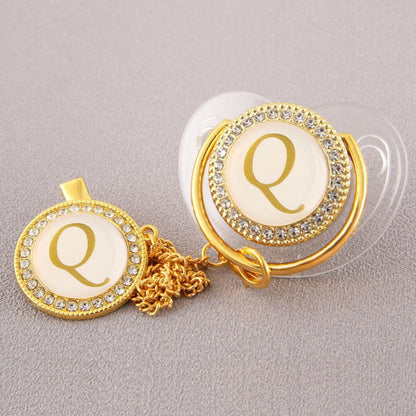 Set Ciuccio Trasparente e oro  Luxury con Clip – Personalizzato con Iniziale 6-12 mesi