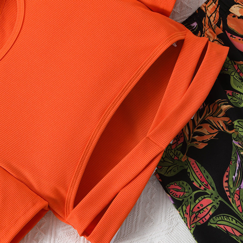 Completo estivo bambina - Top arancione con pantaloni fantasia tropicale