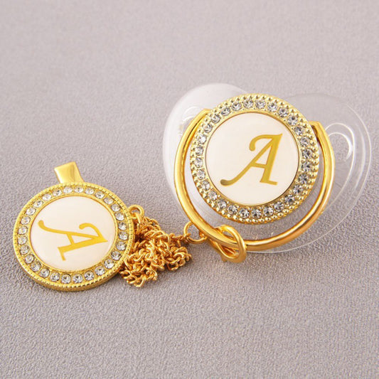 Set Ciuccio Trasparente e oro  Luxury con Clip – Personalizzato con Iniziale 6-12 mesi