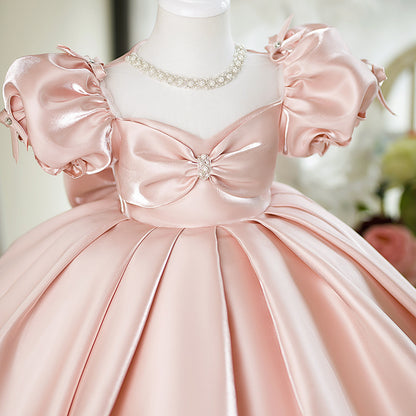 Abito da cerimonia bambina in raso rosa cipria con maniche a palloncino