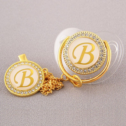 Set Ciuccio Trasparente e oro  Luxury con Clip – Personalizzato con Iniziale 6-12 mesi