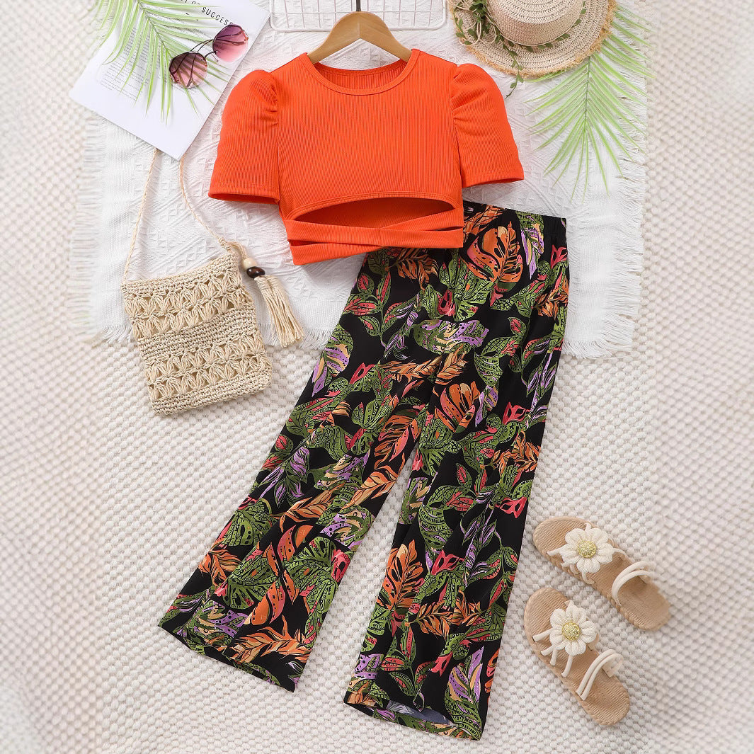 Completo estivo bambina - Top arancione con pantaloni fantasia tropicale