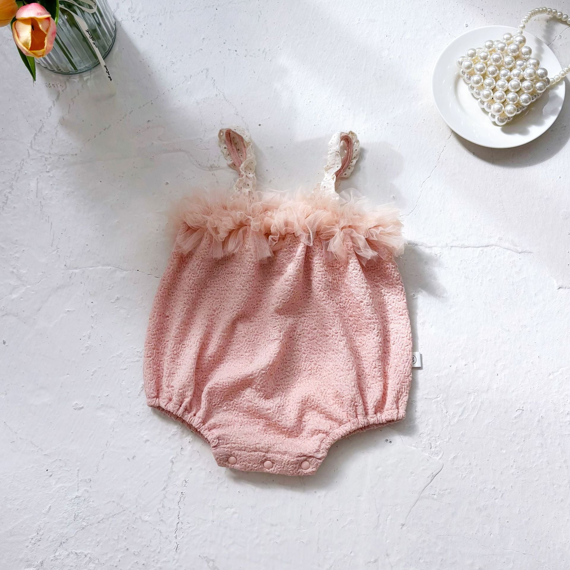 Body bimba elegante rosa cipria con volant in tulle
