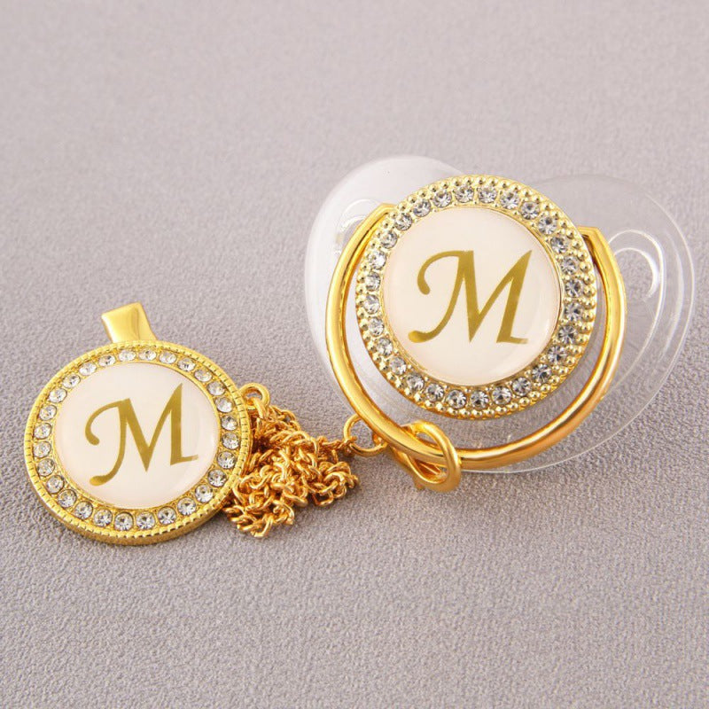 Set Ciuccio Trasparente e oro  Luxury con Clip – Personalizzato con Iniziale 6-12 mesi