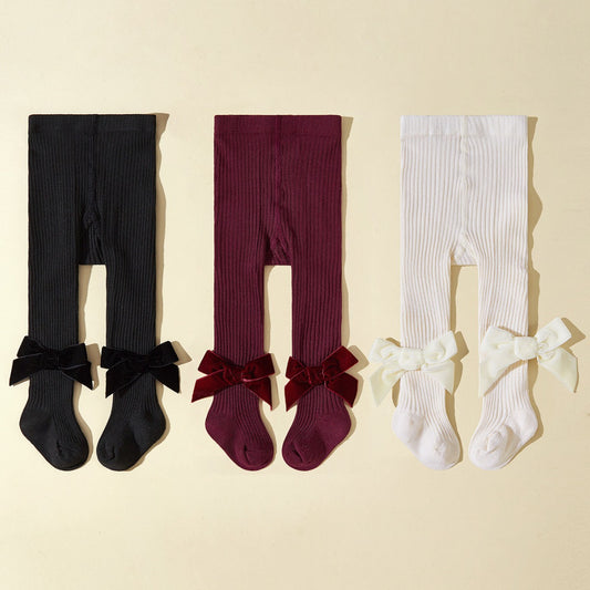 Collant bambina in maglia a costine con fiocco in velluto
